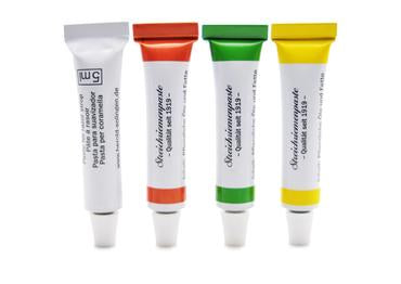 Strop paste tubes in white, red, green and yellow